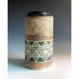 A Troika pottery cylindrical vase with a band of geometric decoration, signed 'Troika Cornwall'