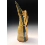 A large Richard Phethean studio pottery jug with abstract yellow and blue slip and glaze decoration,