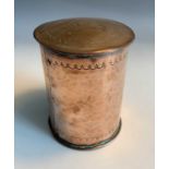 An Arts and Crafts period copper tea caddy of cylindrical form, the lid embossed with text 'Tea',