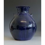 A large blue glaze Trevor Corser urn shaped vase with twin handles, height 29cm, impressed Leach