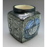 A Troika small cube vase, the green ground decorated in shades of blue and beige and with incised