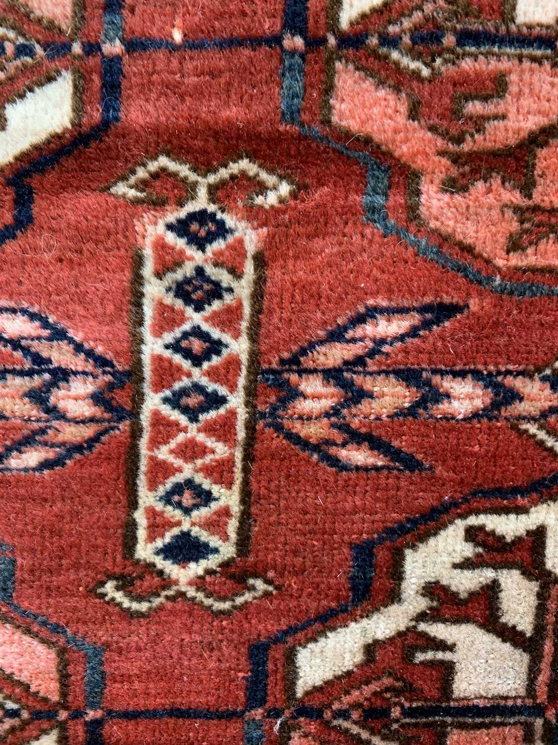 A Tekke carpet, Turkmenistan, circa 1890, the madder field with ten rows of five medallions, - Image 10 of 13