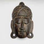 A Balinese carved wood mask, 19th century, 36 x 22cm.
