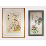 Two Chinese silk embroidered pictures, each decorated with birds perched on a branch, black