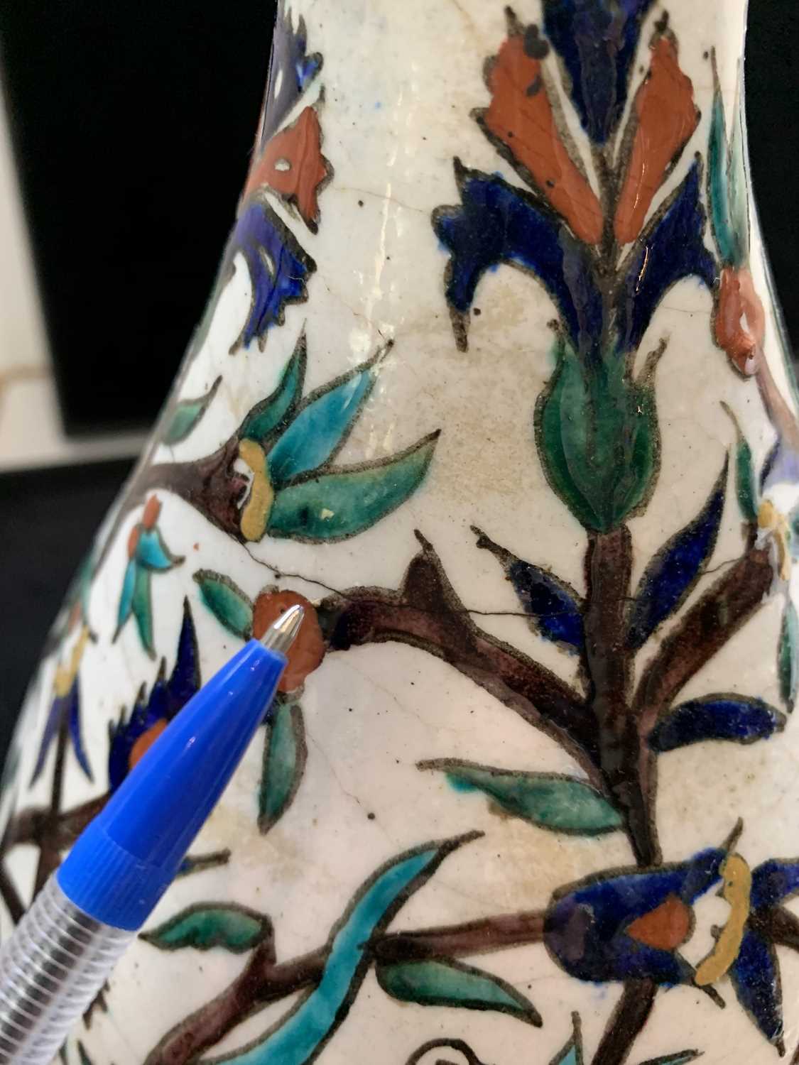 An Iznik pottery vase, 19th century, the bulbous body with a white ground and decorated with - Image 9 of 14