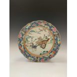 A Chinese Canton famille rose charger, late 19th century, signed, with figures and cart in