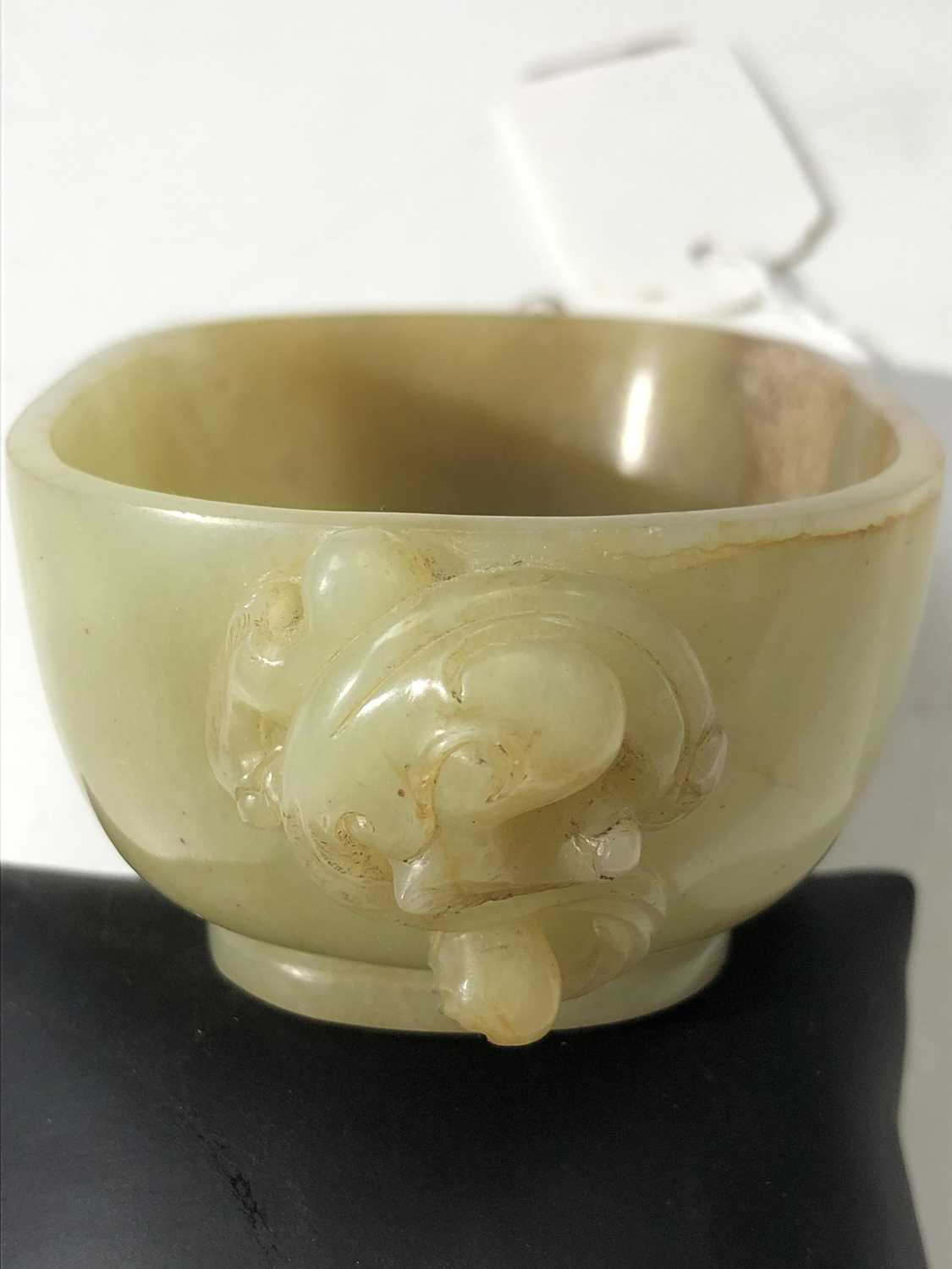 A Chinese jade water pot, 18th century, with twin horned beast handles, the front and rear with - Image 13 of 14