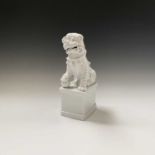 A Chinese blanc de chine dog of fo, height 36.5cm.