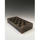 A Chinese export black lacquered folding games board, 19th century, for chess and backgammon,