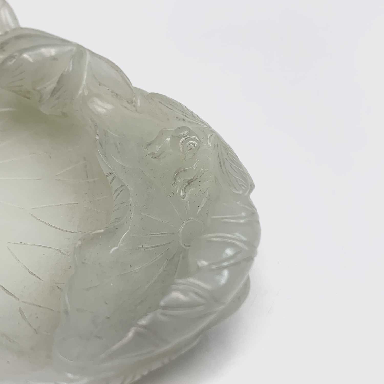 A Chinese white jade 'lotus leaf' brushwasher, 19th Century, height 2.5cm, width 13cm, depth 8.5cm. - Image 14 of 20