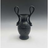 A Chinese bronze archaic style vase, circa 1900, with serpent handles flanking rows of