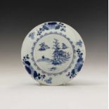 A Nanking Cargo blue and white porcelain plate, 18th century, Christies label, diameter 23cm.