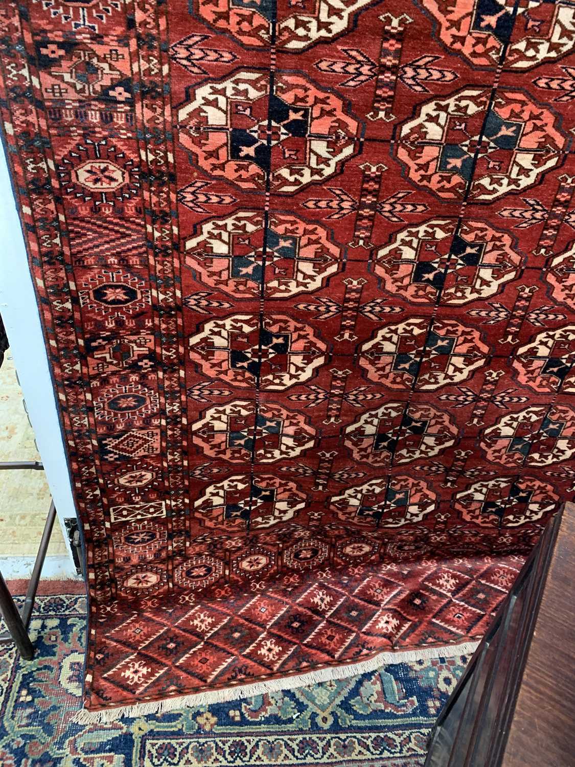 A Tekke carpet, Turkmenistan, circa 1890, the madder field with ten rows of five medallions, - Image 12 of 13