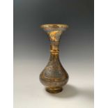 A Cairoware brass vase, Egypt, 19th century, decorated in silver and copper inscription filled