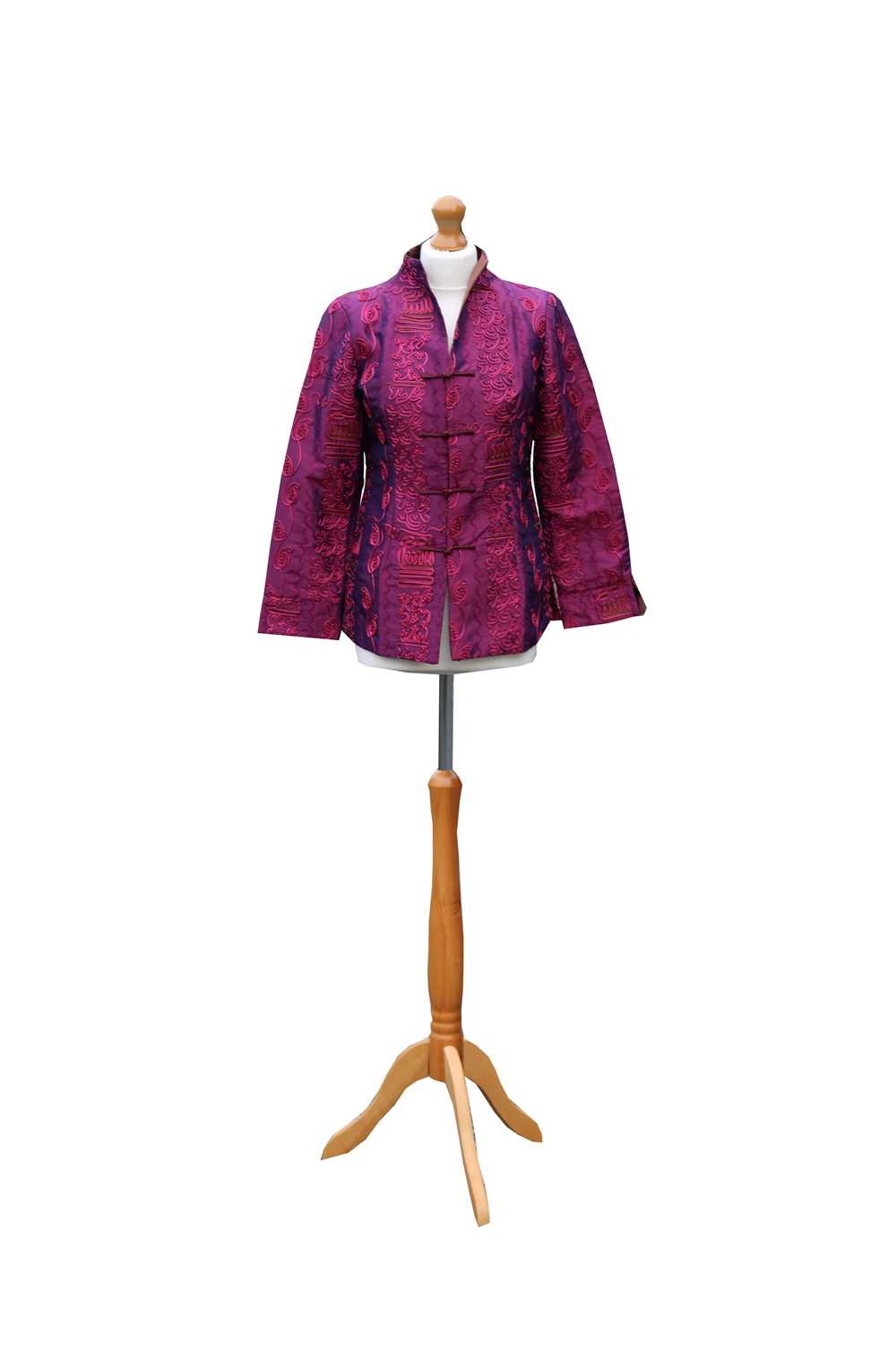 A Chinese lady's jacket, 20th century, in shimmering purple with decorative raised embroidery,