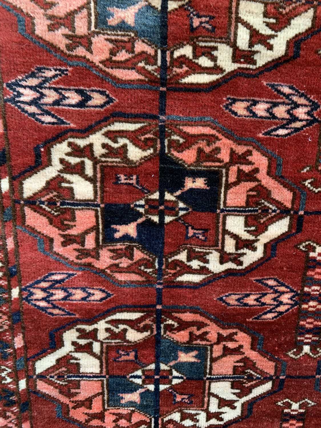 A Tekke carpet, Turkmenistan, circa 1890, the madder field with ten rows of five medallions, - Image 4 of 13