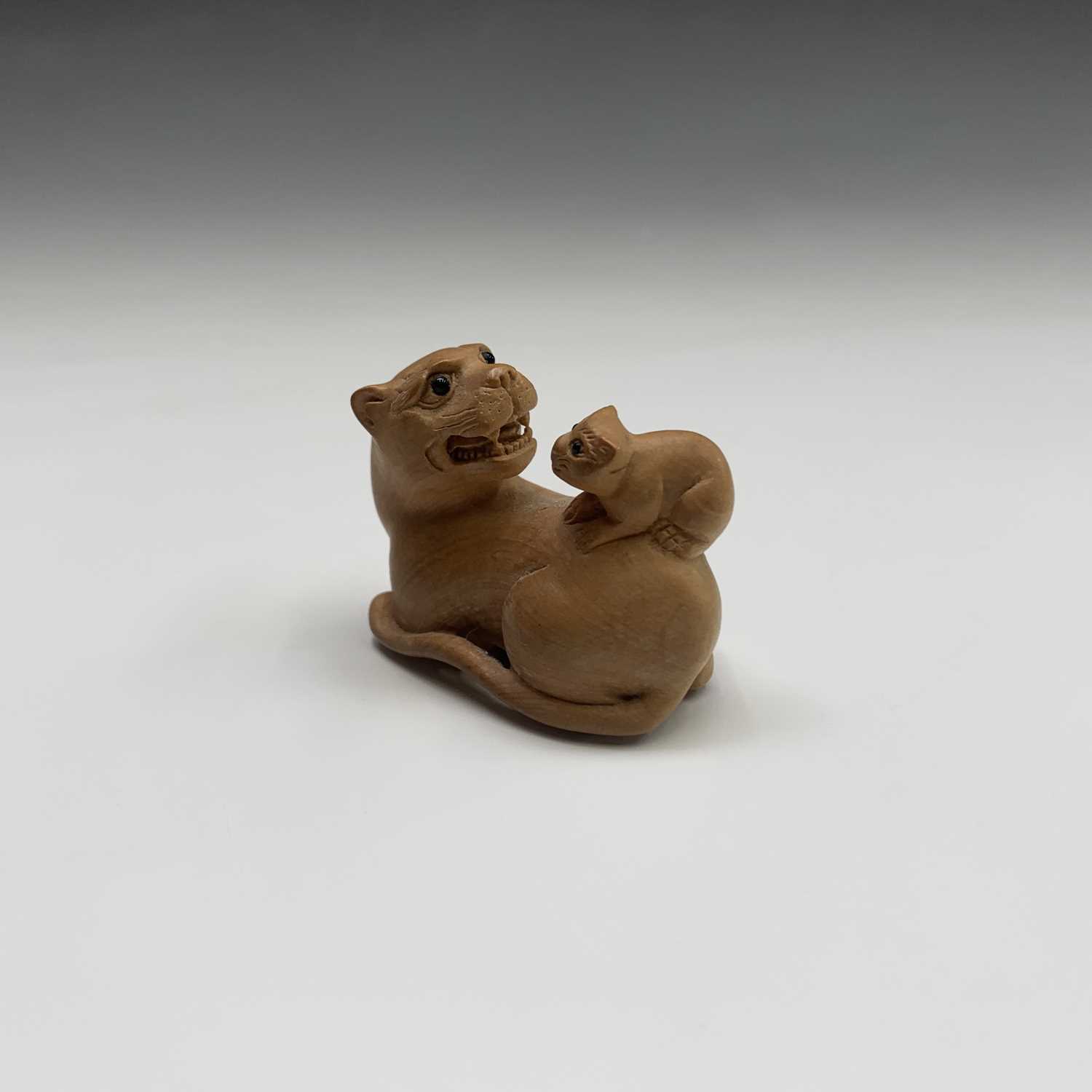 A Japanese carved wood netsuke, signed, width 4.5cm.