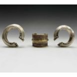 Two silver tribal bangles and a brass cuff, Laos.Condition report: the inner size of all three