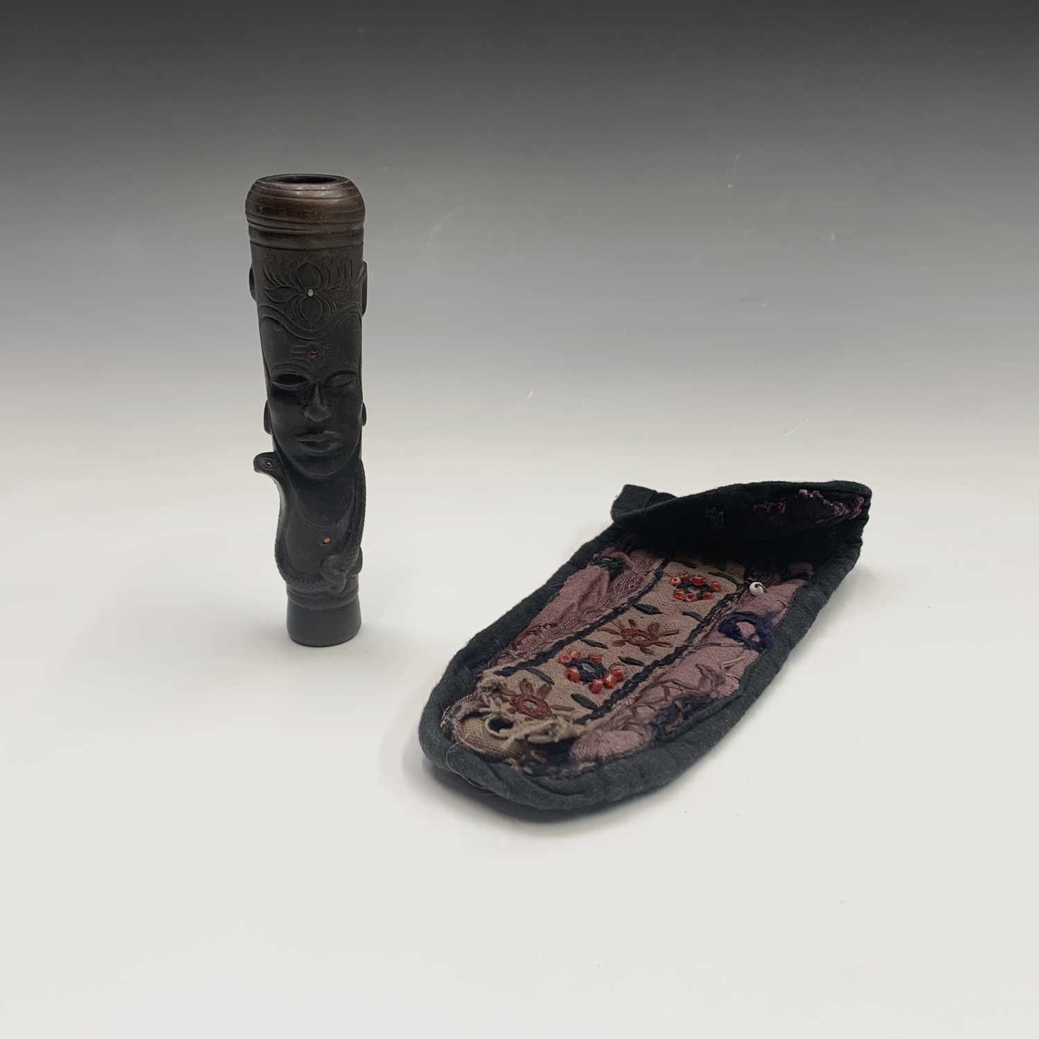 An Indian inlaid pottery chillum pipe, length 12.5cm togehter with an embroidered case.