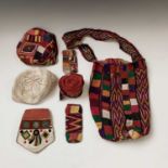 A Turkoman tribe hat, diameter 18cm, a similar bag, two purses and another hat, etc.