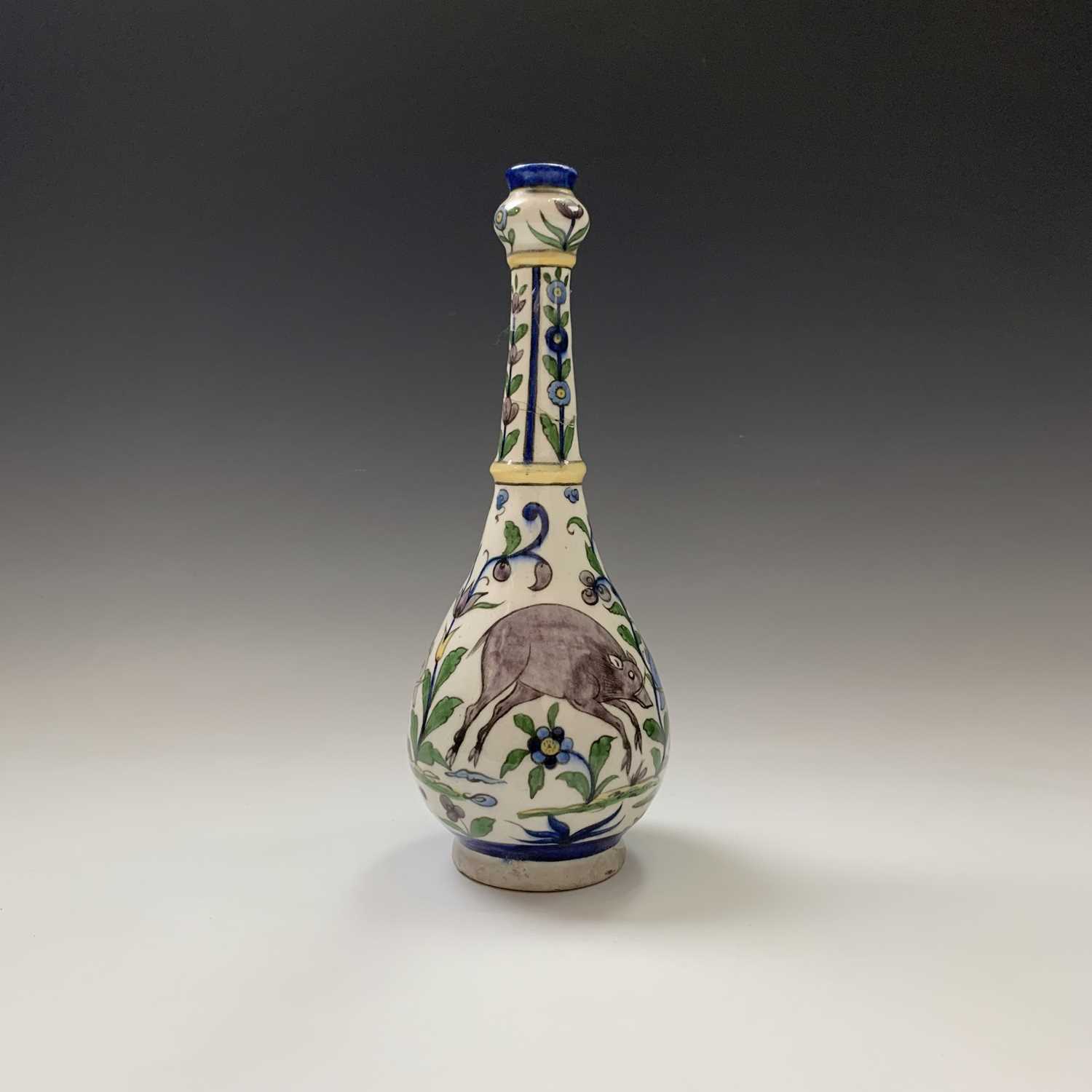 A Persian pottery bottle vase, circa 1900, the white ground with wild boar amongst stylised - Image 4 of 13