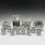 A Japanese porcelain tea service, early 20th century, comprising a teapot, sugar bowl, cream jug,