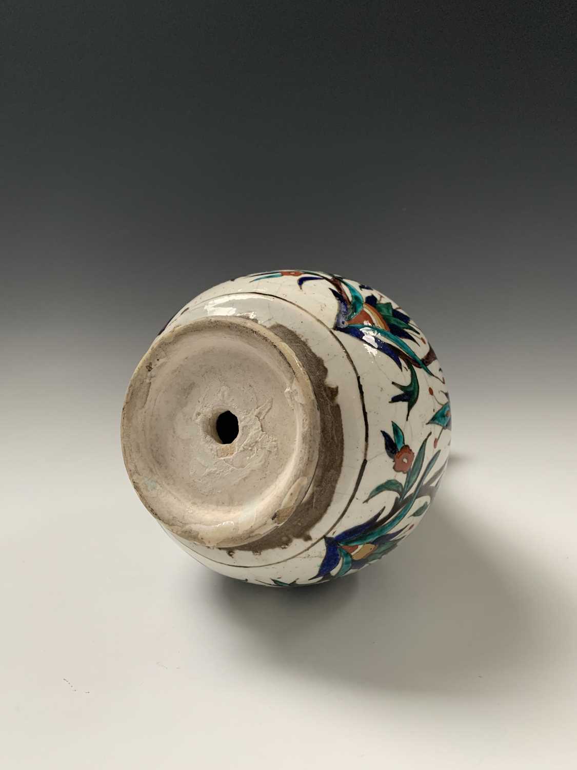 An Iznik pottery vase, 19th century, the bulbous body with a white ground and decorated with - Image 3 of 14