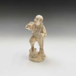 A Japanese ivory figure of a hunter, Meiji Period, with rifle in hand, signed, height 18.5cm.