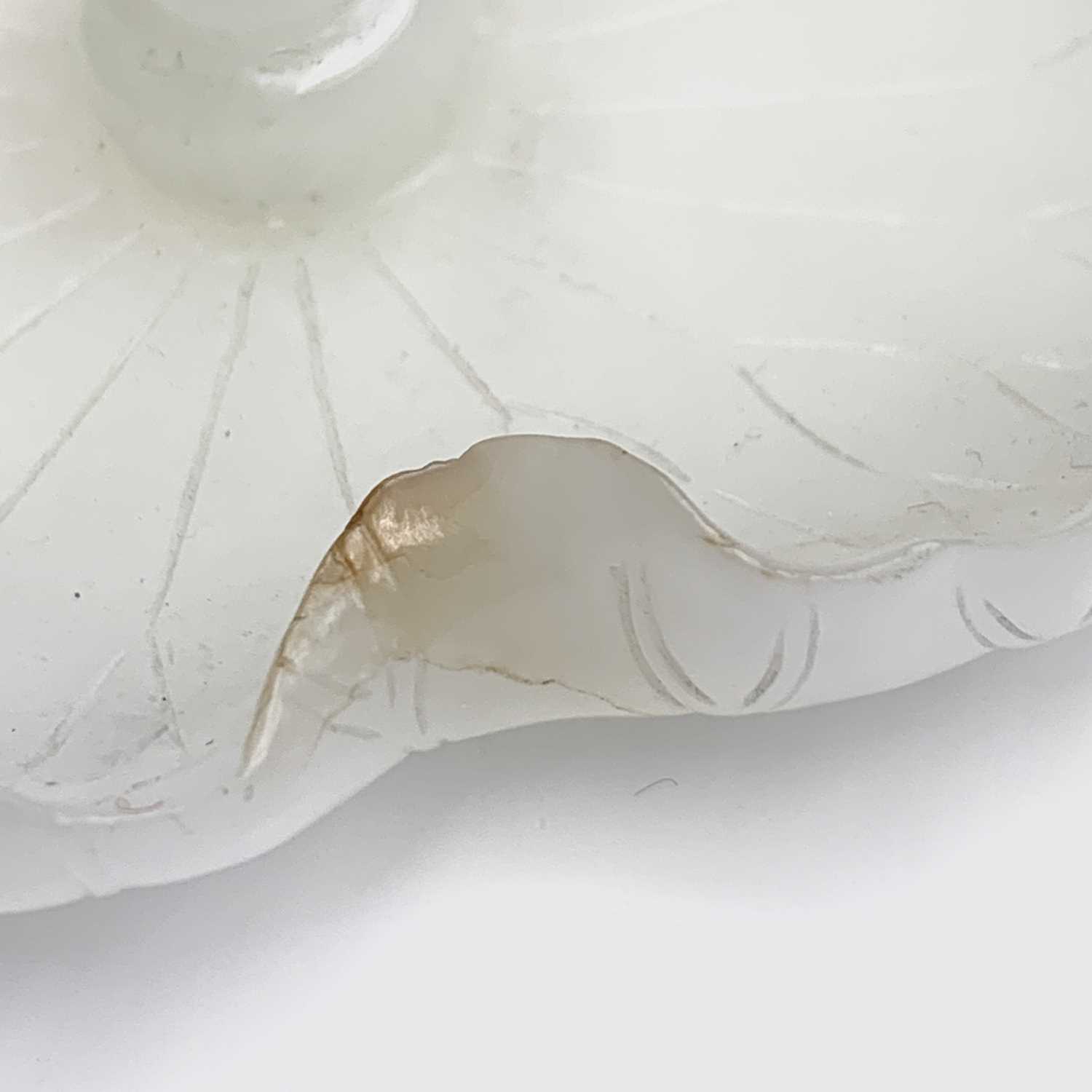 A Chinese white jade 'lotus leaf' brushwasher, 19th Century, height 2.5cm, width 13cm, depth 8.5cm. - Image 19 of 20