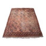 An Afghan Ersari carpet, the camel field with six rows of three octagonal medallions, within a