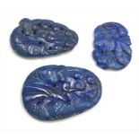 Three Chinese lapis lazuli pendants, each decorated with fish, lengths 6.3cm, 5.5cm and 4.2cm.