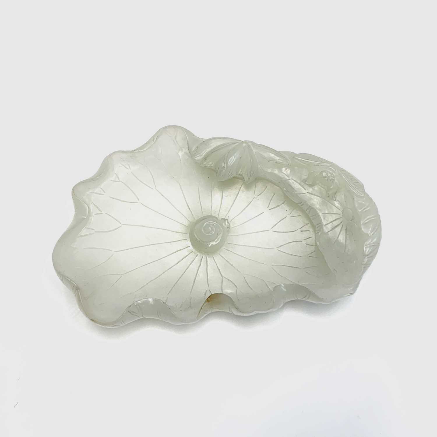 A Chinese white jade 'lotus leaf' brushwasher, 19th Century, height 2.5cm, width 13cm, depth 8.5cm. - Image 17 of 20