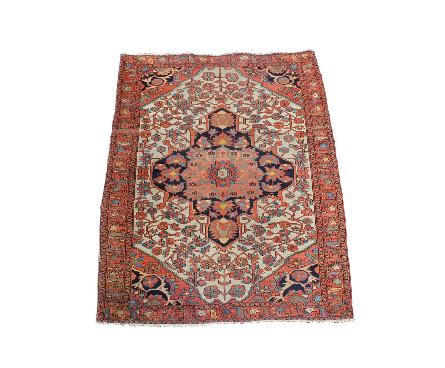 A Sarough rug, West Persia, the ivory field with an indigo central medallion, with palmettes and