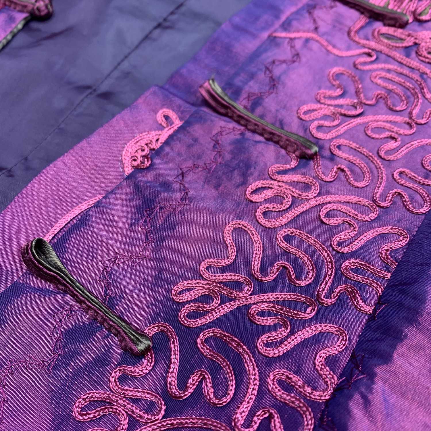 A Chinese lady's jacket, 20th century, in shimmering purple with decorative raised embroidery, - Image 3 of 3