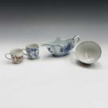 A Chinese blue and white porcelain sauce boat, Qianlong Period. two Chinese porcelain cups and a