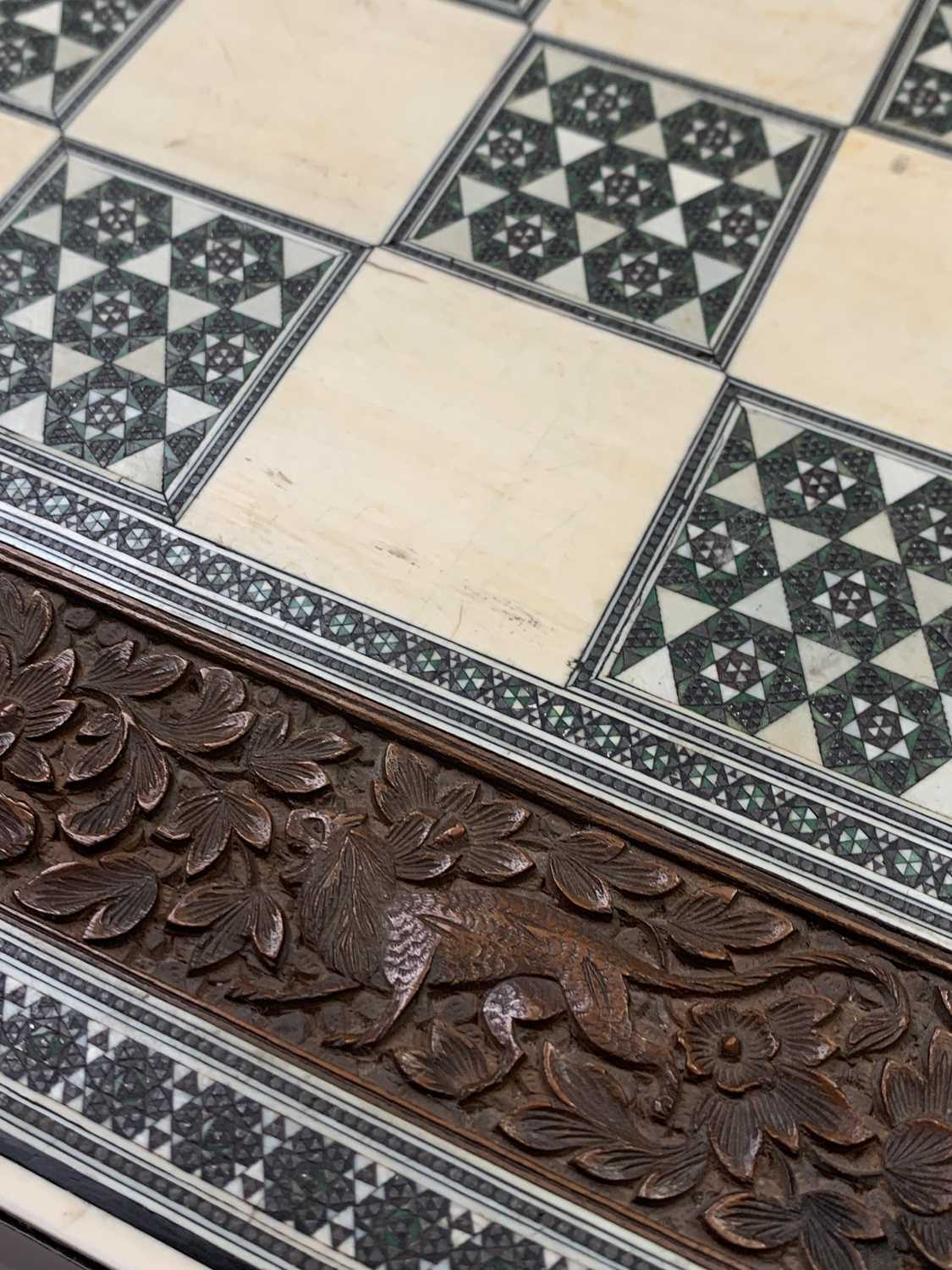 An Anglo-Indian sandalwood games board, 19th century, with ivory and sadeli chess squares within a - Image 5 of 6