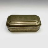 A Malay brass canted rectangular betel box, 19th century, engraved with scrolling leafy vines and