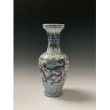 A Chinese Wucai porcelain baluster vase, Wanli six character mark, the stylised dragon and phoenix