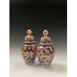A pair of Japanese imari vases and covers, 19th century, height 29.5cm.Condition report: Uk postage:
