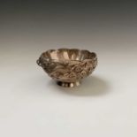 A Chinese silver footed bowl, signed, 226 grams, decorated with a three-clawed dragon on a cloud