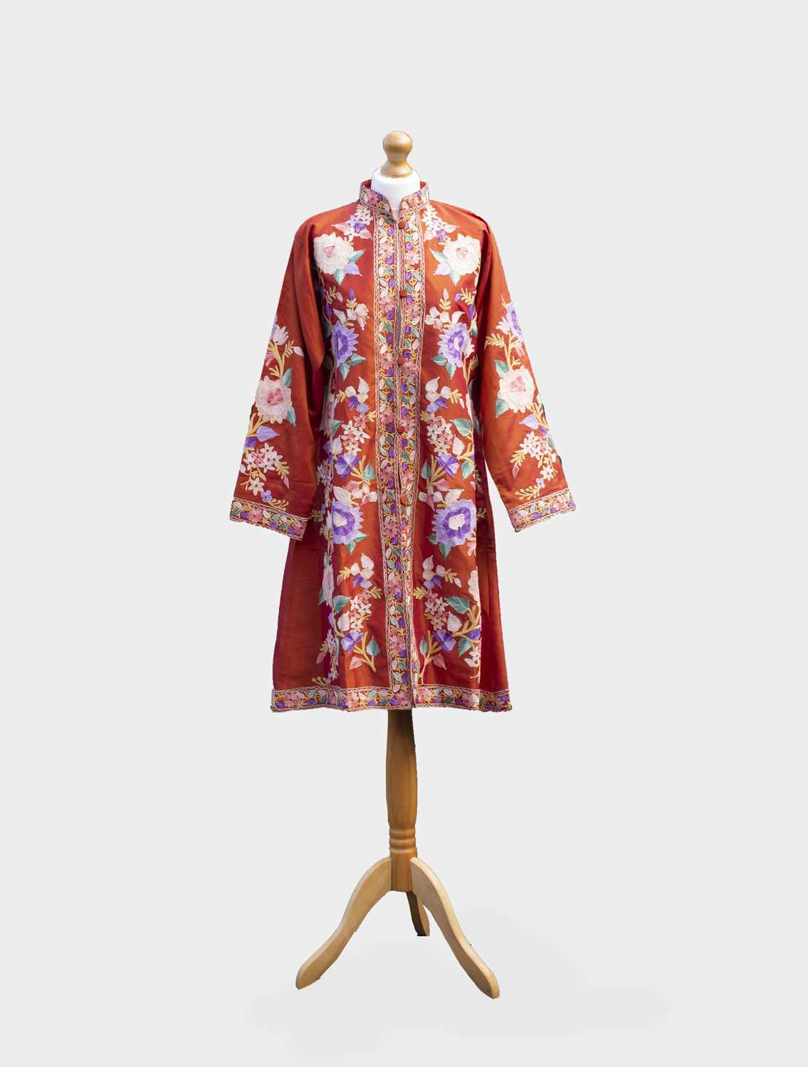 An Indian crewel work robe, early 20th century, decorated with large polychrome flowering