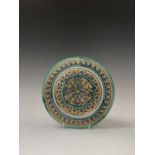A Moroccan pottery dish, late 19th century, diameter 23cm.Condition report: Small chips and a firing