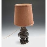 A Chinese bronze lidded urn, adapted to a table lamp, height of urn 31cm.