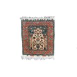 A Turkish silk mat, with label inscribed 'Istanbul-Cinar, Pure Silk', the ivory mihrab with a