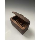 An Indian carved sandalwood cigarette box, the exterior with scrolling foliate decoration and
