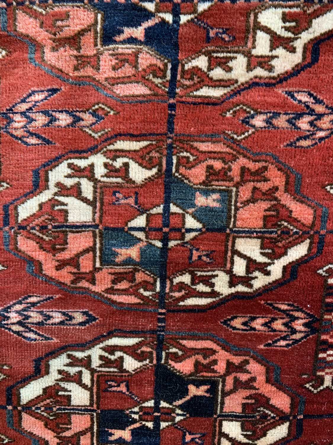 A Tekke carpet, Turkmenistan, circa 1890, the madder field with ten rows of five medallions, - Image 9 of 13