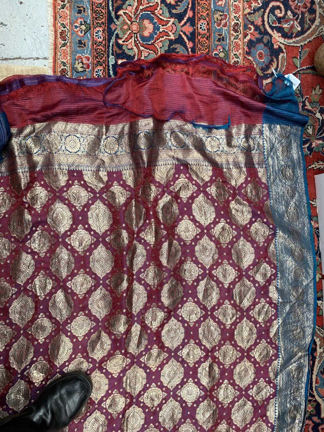 A North Indian sari, the red ground with rows of gold metal thread medallions, 488 x 109cm.Condition - Image 16 of 17