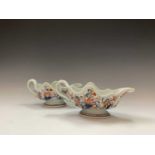 A pair of Chinese export Imari pattern sauce boats, 18th century, one restored, height 10cm,