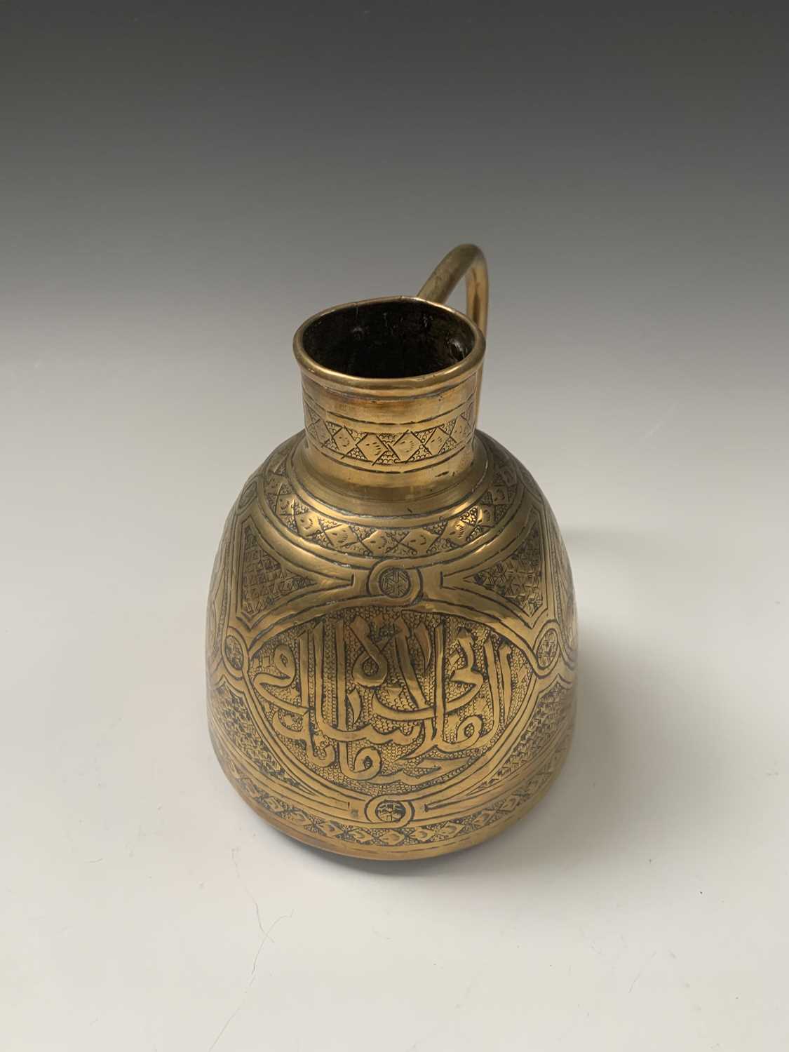 A Persian brass hanging oil lamp, width 17.5cm, a Cairoware brass jug, height 14cm and three - Image 5 of 12