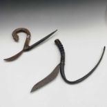 A Chinese rice scythe, with a buffalo horn handle and another with a carved wood handle.